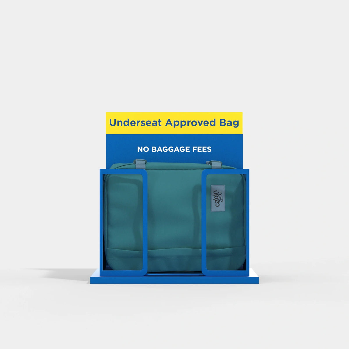 A teal Underseat Approved Bag with gray handles, displayed inside a blue metal frame with a yellow and blue sign that reads 'Underseat Approved Bag' and 'NO BAGGAGE FEES'.