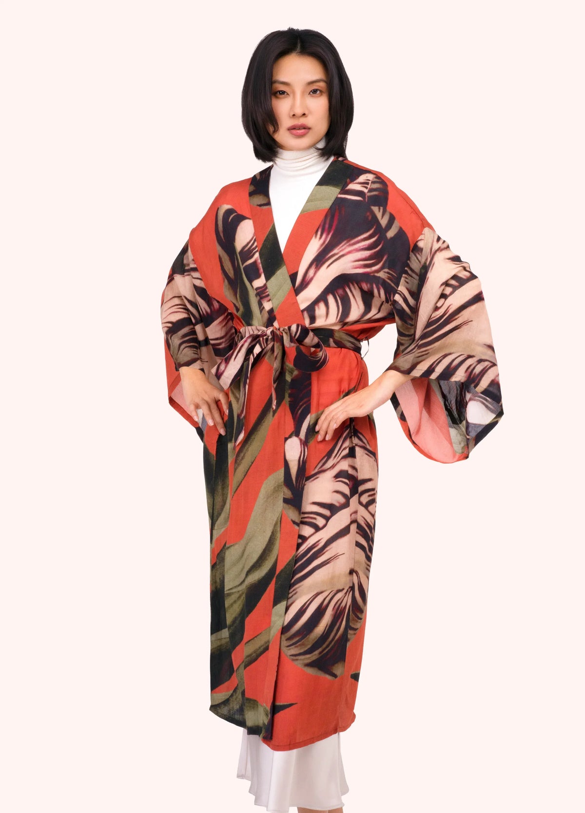 Woman wearing a kimono with measurements indicated on a white background by Weirs Gifts