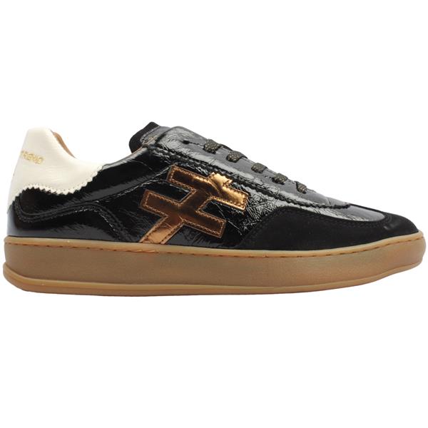 A black leather low-top sneaker with a glossy patent finish, featuring a metallic bronze geometric logo on the side, a cream-colored heel tab with gold lettering, and a gum brown sole at Weirs Gifts