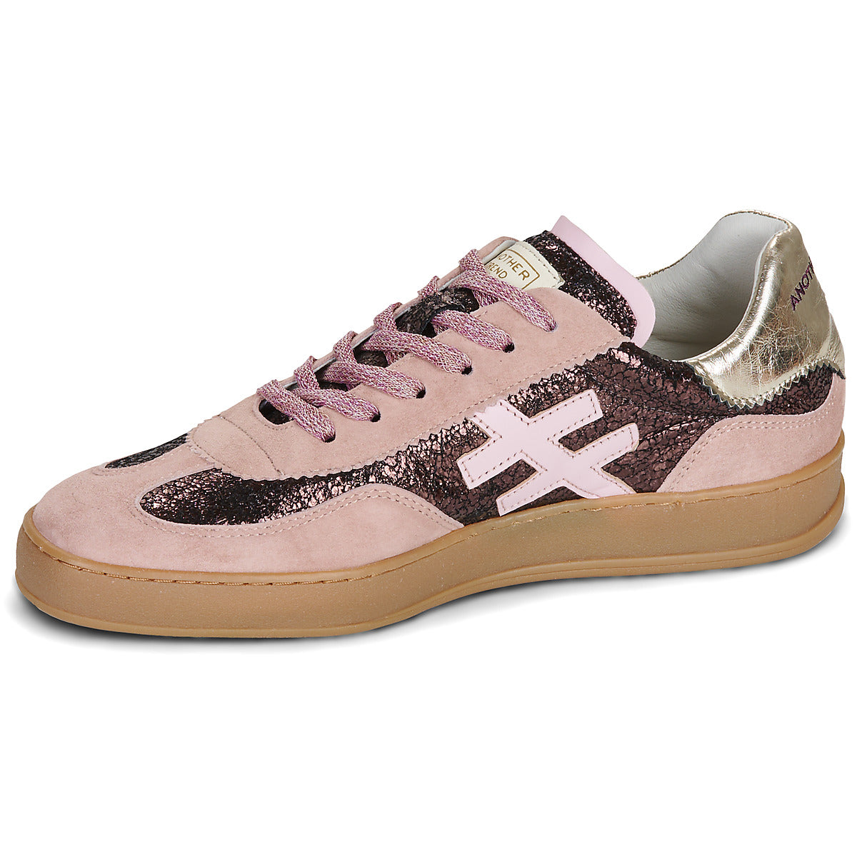 A low-top sneaker in light pink suede and glittery dark pink with a metallic silver heel counter, featuring a light pink cross logo on the side and a gum sole at Weirs Gifts