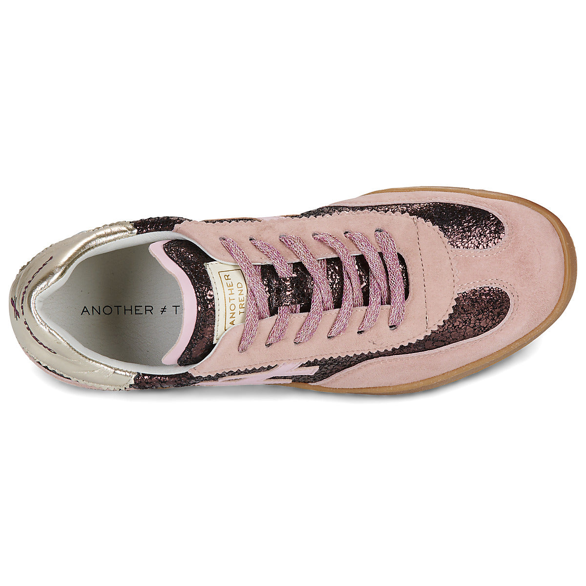 A low-top sneaker in light pink suede and glittery dark pink with a metallic silver heel counter, featuring a light pink cross logo on the side and a gum sole at Weirs Gifts