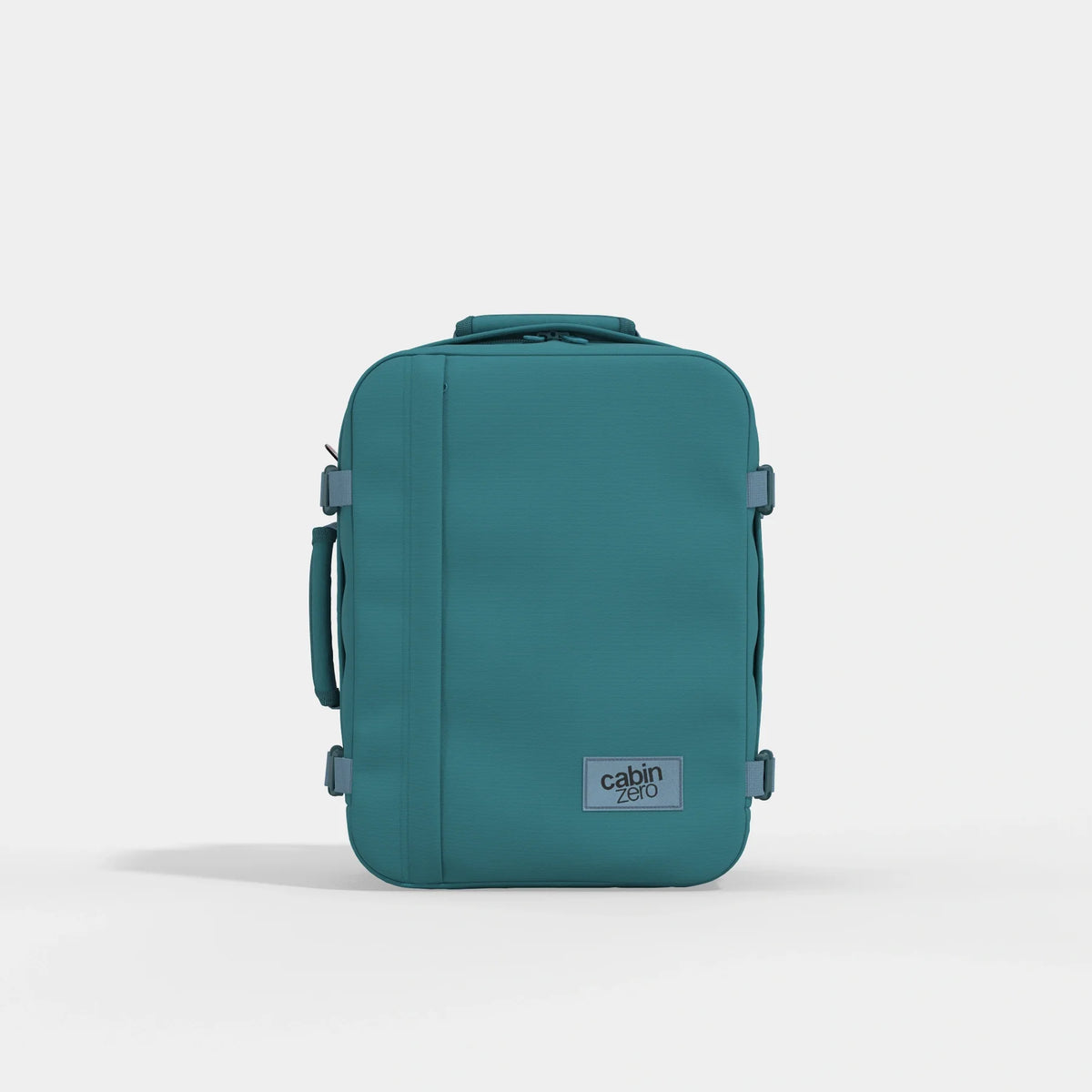 A teal blue-green Cabin Airline carry-on backpack shown from the front on a light gray studio background.
