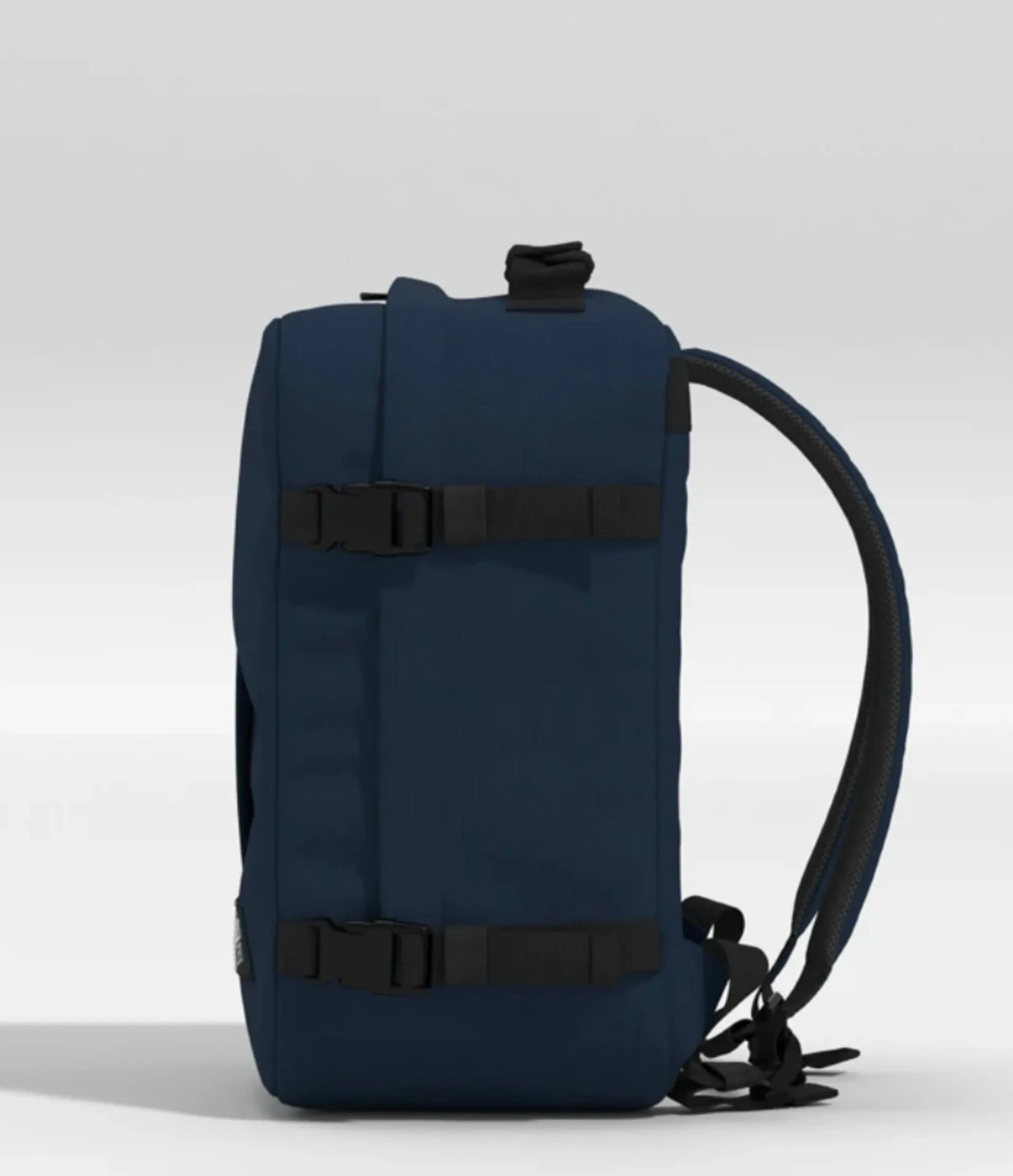 A navy blue backpack shown from the side, featuring black compression straps with buckles and a black shoulder strap, set against a light gray studio background.