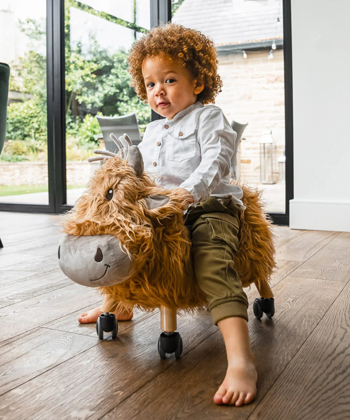 Fabulous Gifts Little Bird Told Me Hubert Highland Cow Ride On Toy by Weirs of Baggot Street