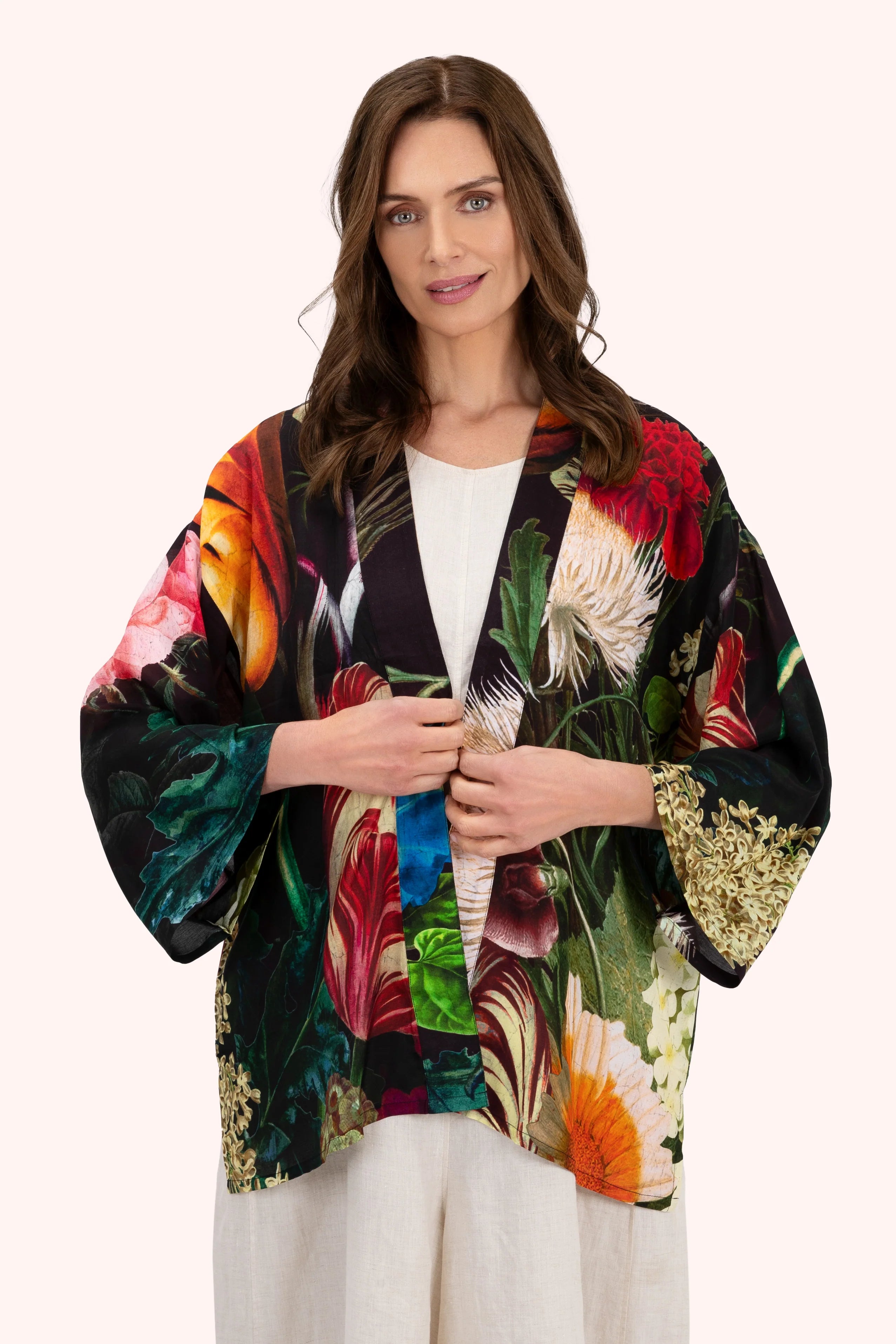 Woman wearing a colorful floral kimono against a white background by Weirs Gifts