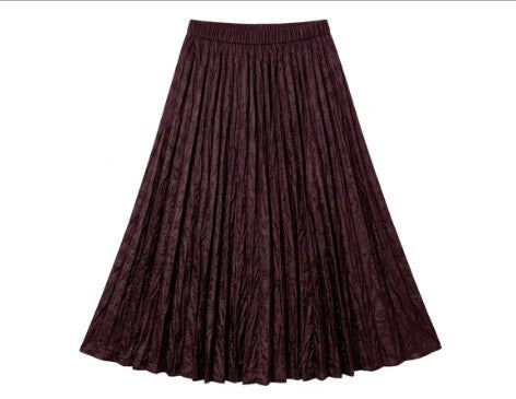 A pleated A-line skirt in a deep burgundy or maroon color, featuring a textured jacquard pattern and an elastic waistband, shown against a plain white background at Weirs Gifts