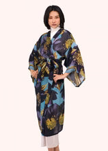 Woman wearing a floral patterned kimono on a white background by Weirs Gifts