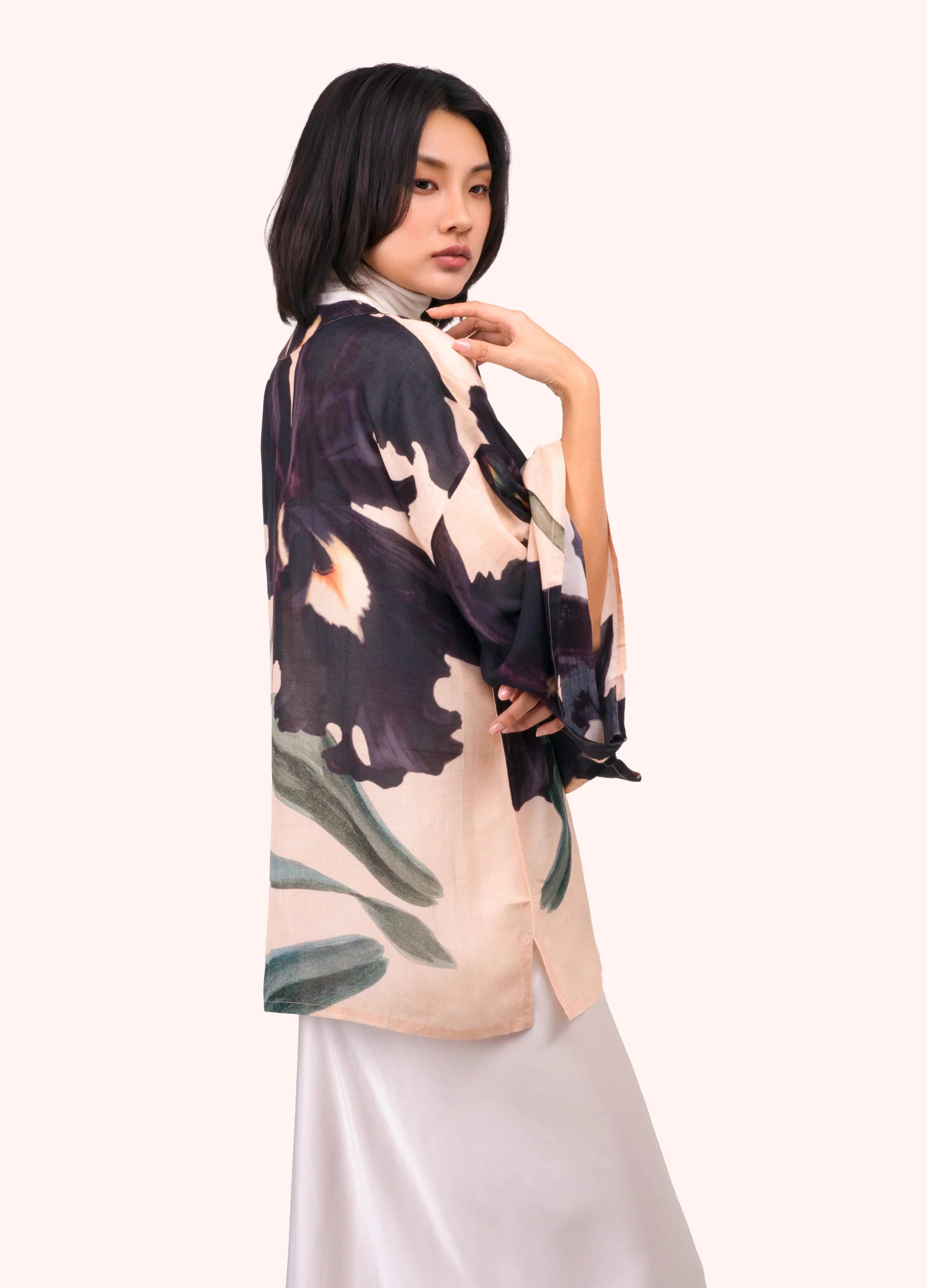 Woman wearing a floral kimono-style top on a white background by Weirs Gifts