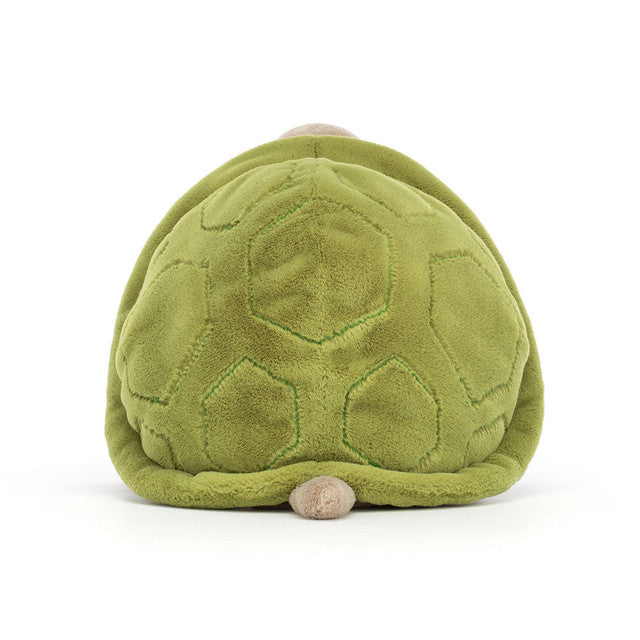Green turtle shell plush toy on a white background