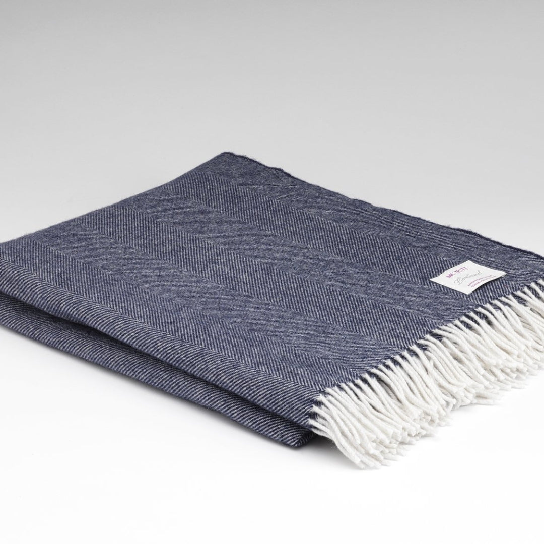 McNutt of Donegal | Lambswool Throw Navy Herringbone by Weirs of Baggot Street